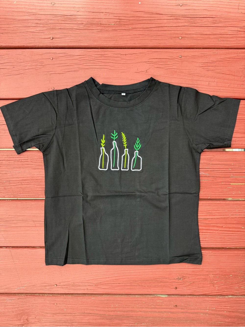 Black Short Sleeve Tee with Bottle & Plant Graphic